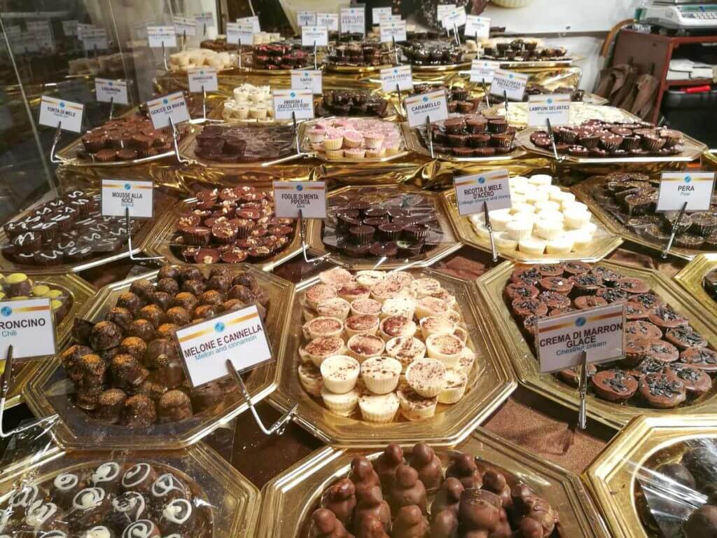 Assorted chocolate confections with different flavors. They are all chocolate made in Turin, Italy.