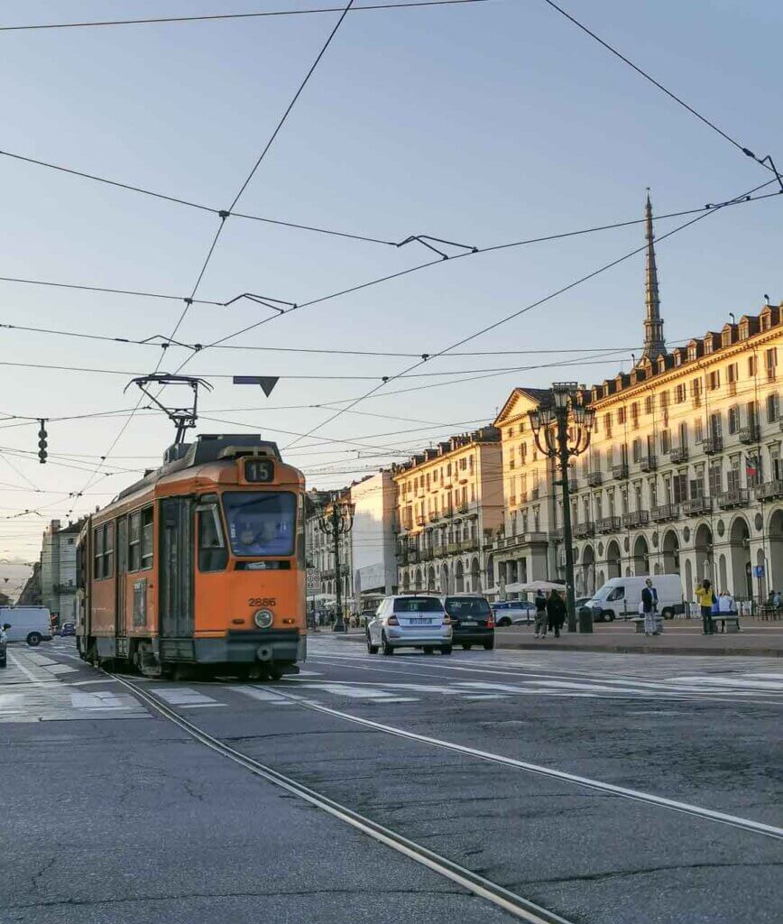 Cars and a tram on the streets of the Italian city of Turin.