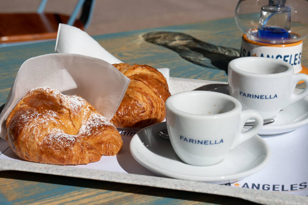 Two croissants and two espresso coffee served at Outlet Turin. 