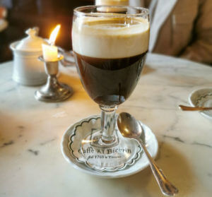A glass of Bicerin, a drink made of coffee, chocolate and heavy cream. 